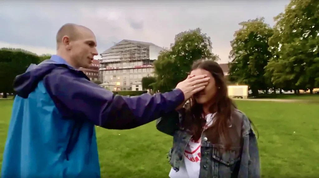 Peter Skov praying for healing the eyes of a young woman.