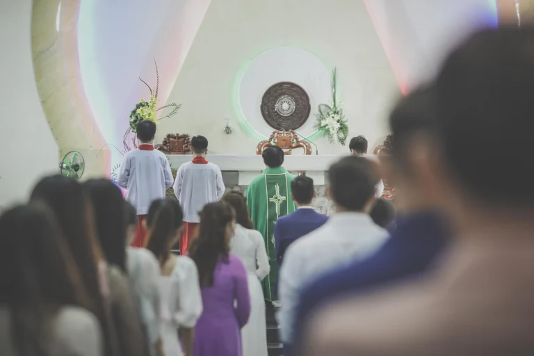 A church congregation gathered for worship, seen from behind