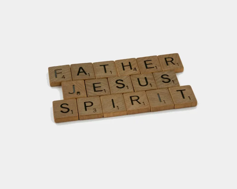 Scrabble tiles spelling Father, Jesus, Spirit