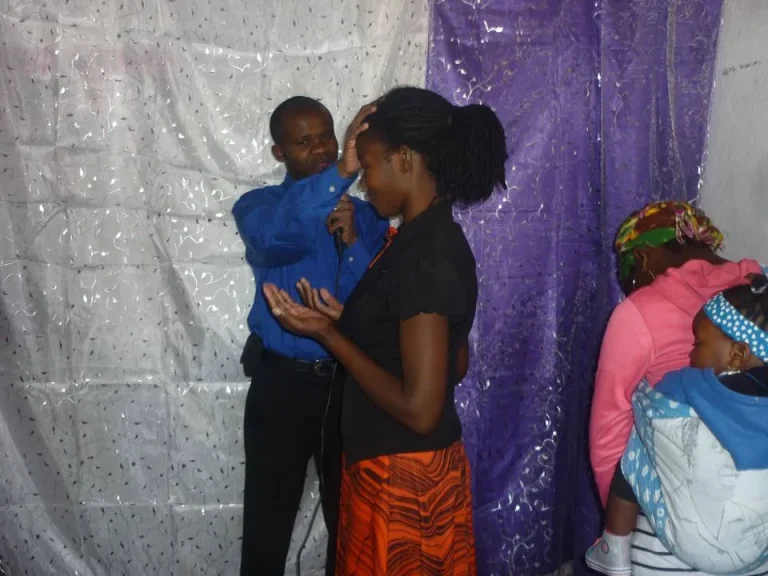 Laying on hands in prayer for healing