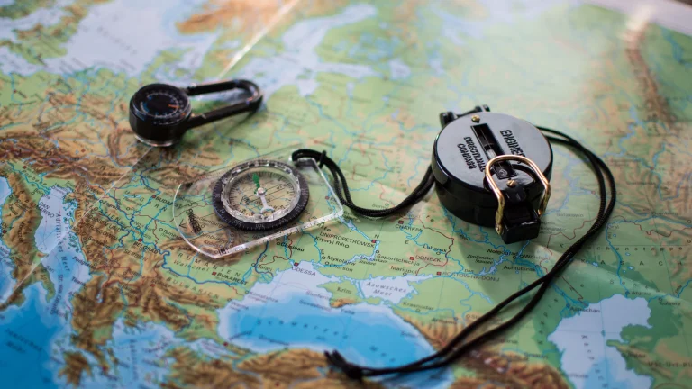Two compasses on a map, a picture of staying on course